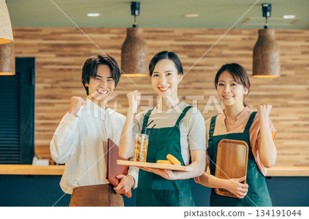 Men and women working at a cafe Men and women working at a cafe 134191044