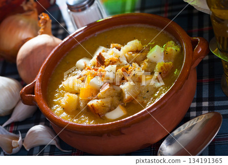Vegetable soup with croutons and cheese 134191365