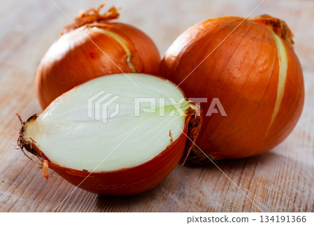 Raw whole and sliced onions 134191366