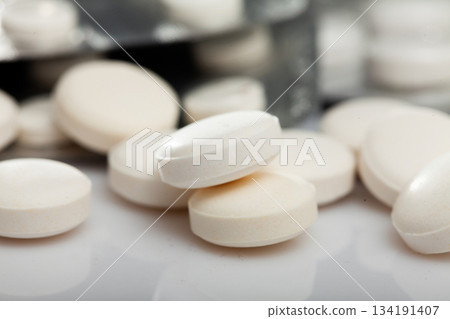 Many different pills and medical capsules close up Many different pills and medical capsules close up 134191407