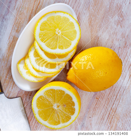 Lemon slices on wooden background Lemon slices on wooden background 134191408