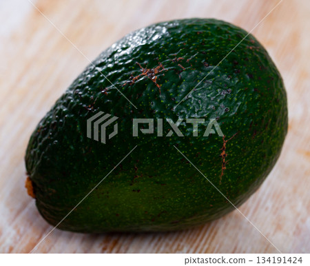 Image of ripe avocado at table, healthy food Image of ripe avocado at table, healthy food 134191424