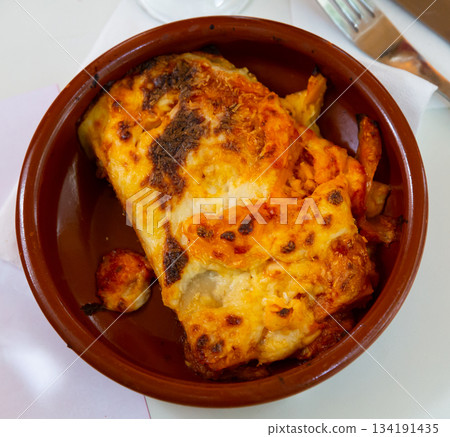 Italian meat lasagna in a clay plate Italian meat lasagna in a clay plate 134191435