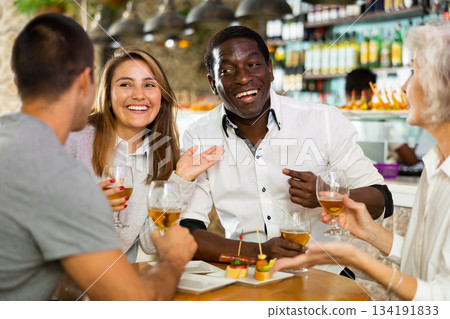 View on the diverse couple and a group View on the diverse couple and a group 134191833