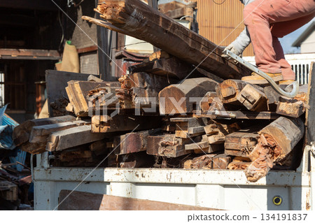 Removal of waste materials from an old house at a demolition site 134191837