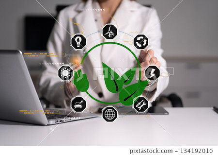 Businesswoman using computer on CO2 emission reduction concept with global warming icon. along with climate, energy, sustainability, environment. Businesswoman using computer on CO2 emission reduction concept with global warming icon. along with climate, energy, sustainability, environment. 134192010