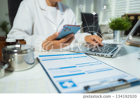 Medicine doctor hand working with modern digital tablet computer and smartphone interface as medical network concept. Medicine doctor hand working with modern digital tablet computer and smartphone interface as medical network concept. 134192020