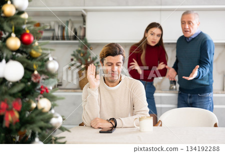 Man and woman quarreling with man 134192288