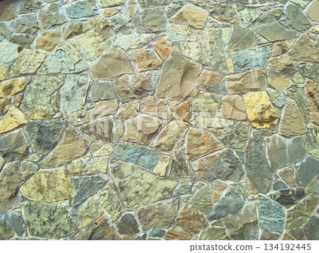 Paved wall with rough granite stones, texture background Paved wall with rough granite stones, texture background 134192445