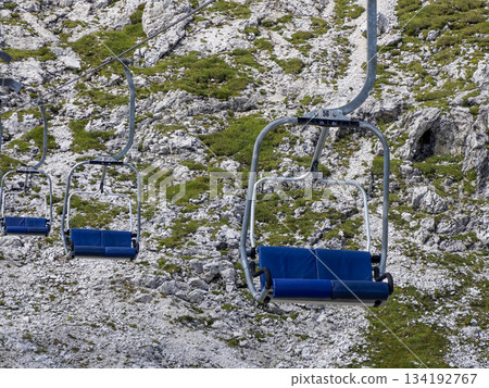 Chairlift in dolomites detail, summer season Chairlift in dolomites detail, summer season 134192767