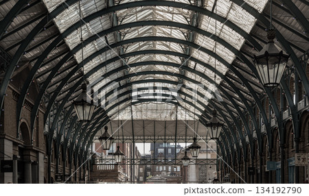 Architecture greco-roman style with iron glass roof and Lanterns hanging on the ceiling in Covent Garden. Architecture greco-roman style with iron glass roof and Lanterns hanging on the ceiling in Covent Garden. 134192790