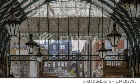Architecture greco-roman style with iron glass roof and Lanterns hanging on the ceiling in Covent Garden. Architecture greco-roman style with iron glass roof and Lanterns hanging on the ceiling in Covent Garden. 134192795