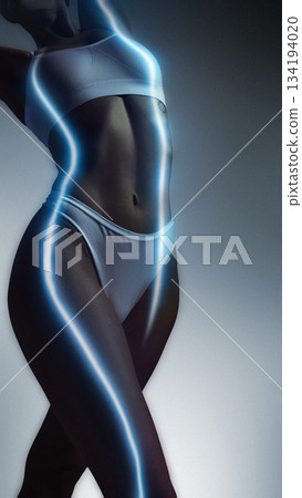 Futuristic artwork of female body with blue glowing energy lines 134194020