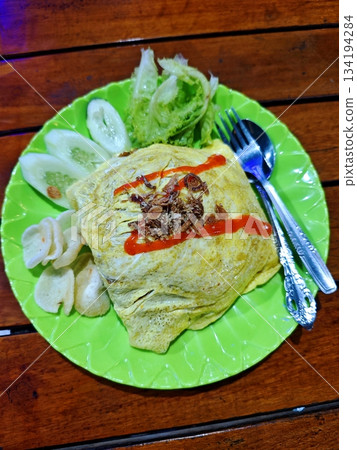 Delicious Indonesian Fried Rice Wrapped in Omelette Delicious Indonesian Fried Rice Wrapped in Omelette 134194284