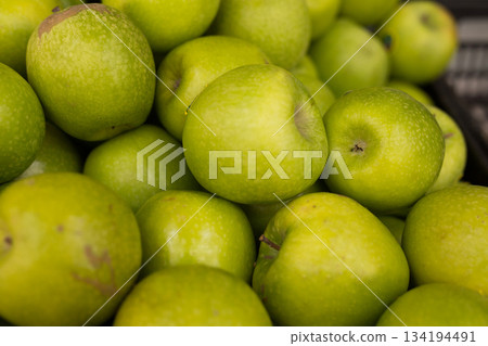 appetizing green apples on counter in market appetizing green apples on counter in market 134194491