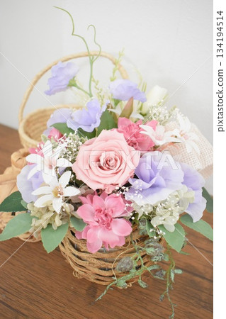 Spring-colored basket arrangement 134194514