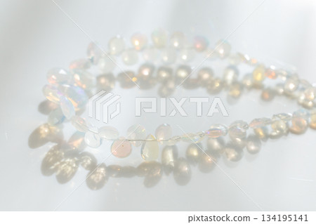 Ethiopian Opal Briolette | Natural opal material with soft, sparkling play of color 134195141