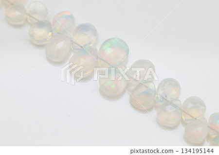 Ethiopian Opal Briolette | Natural opal material with soft, sparkling play of color 134195144