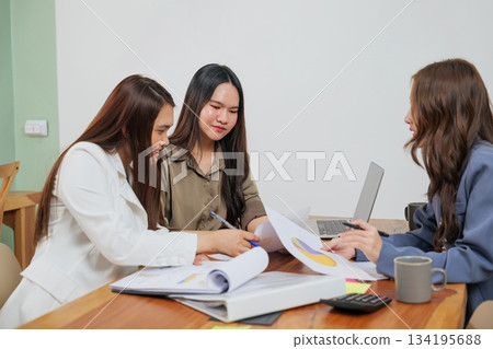 Busy office work people meet market team women, collaborating on important business strategy, analyzing market data, developing project plans during productive conference room discussion. Busy office work people meet market team women, collaborating on important business strategy, analyzing market data, developing project plans during productive conference room discussion. 134195688