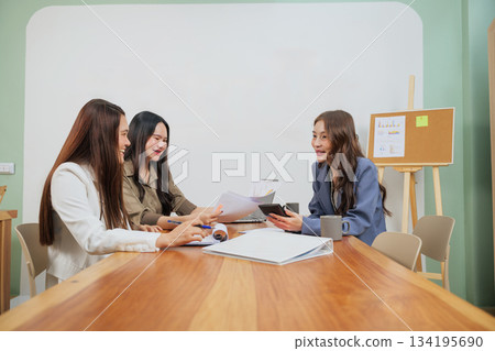 Busy office work people meet, market team women actively collaborate in modern conference room to discuss business strategy, review finance document, analyze data and plan company growth for success. 134195690