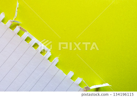 Ripped white paper with lined texture on a bright yellow background. The torn edge creates a contrast between the two colors. Ripped white paper with lined texture on a bright yellow background. The torn edge creates a contrast between the two colors. 134196115