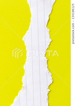 Ripped white paper with lined texture on a bright yellow background. The torn edge creates a contrast between the two colors. Ripped white paper with lined texture on a bright yellow background. The torn edge creates a contrast between the two colors. 134196125