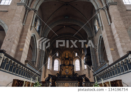 Interior view High Cathedral ceiling Saint Peter german Trier Dome. Architecture detail ornament sculptures angels saints ornate floral motifs radial composition. 134196754