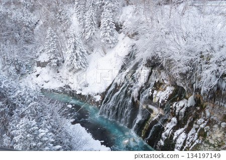 Shirahige waterfall or white beard waterfall in winter. Famous attractions in the shirogane hot spring area of Biei. Hokkaido, Japan. 134197149