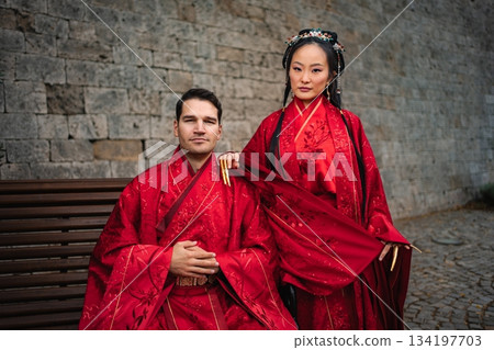 Intercultural couple celebrating traditional Chinese wedding ceremony 134197703