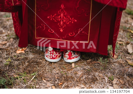 Celebrating Chinese wedding tradition with bride's red shoes Celebrating Chinese wedding tradition with bride's red shoes 134197704