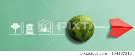 Environmental sustainability with a globe that represents the earth and a paper airplane flying from that globe, plus a tree, a chart report, and a CO2 reduction. Concept of Climate Investment 134197813