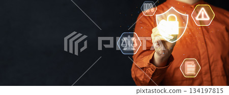 Person hand interacting with a virtual shield icon with a padlock, representing data protection and security, surrounded by legal and compliance icons. Concept of Data Privacy Enforcement Person hand interacting with a virtual shield icon with a padlock, representing data protection and security, surrounded by legal and compliance icons. Concept of Data Privacy Enforcement 134197815