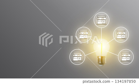Light bulb illuminating and connecting to multiple shop icons, symbolizing new ideas driving business expansion and growth through a franchise network model. Concept of Expand 134197850