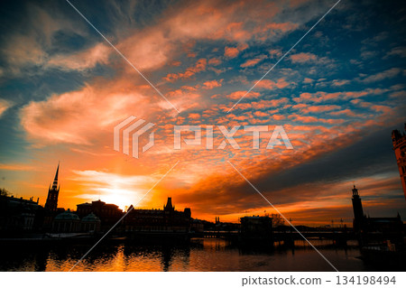 Burning evening sky and cityscape Burning evening sky and cityscape 134198494