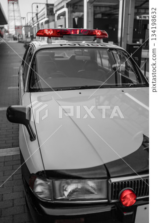 A police car with its red lights shining 134198632
