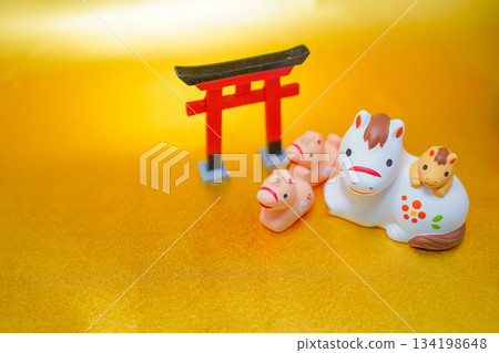 Torii gate and a group of horses and their children Torii gate and a group of horses and their children 134198648