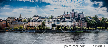 Stockholm Sweden panoramic view downtown and Gamla Stan Old Town over calm water 134198861