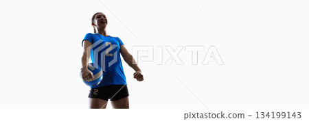 Young volleyball athlete celebrating with ball for digital sports branding and UI banners. Banner Young volleyball athlete celebrating with ball for digital sports branding and UI banners. Banner 134199143