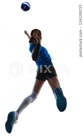 Volleyball athlete suspended mid-air during powerful serve motion. 134199155
