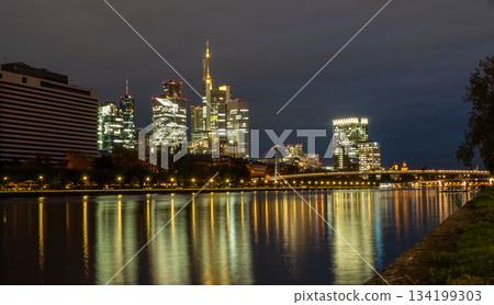 Frankfurt skyline in the evening. Sunset at blue hour with illuminated skyscrapers from the financial and business district 134199303