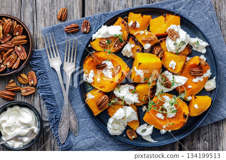baked butternut squash with cheese, thyme, pecan baked butternut squash with cheese, thyme, pecan 134199513