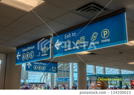 Charlotte, NC, USA, August 28, 2025: walk through a bright and spacious concourse at Charlotte Douglas International Airport Charlotte, NC, USA, August 28, 2025: walk through a bright and spacious concourse at Charlotte Douglas International Airport 134200023