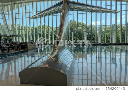 Charlotte, NC, USA, August 28, 2025: walk through a bright and spacious concourse at Charlotte Douglas International Airport 134200443
