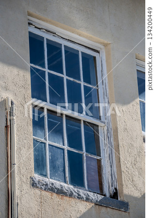 old and outdated windows on historic building 134200449