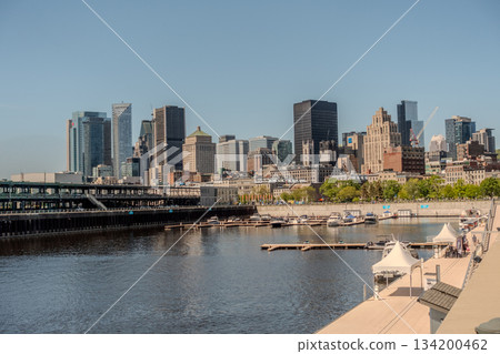Montreal city skyline panorama over river in the day with urban buildings Montreal city skyline panorama over river in the day with urban buildings 134200462