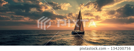 Sailboat sailing on ocean water during a colorful cloudy sunset creating a romantic mood. Sailboat cruising at sunset with a couple on board Sailboat sailing on ocean water during a colorful cloudy sunset creating a romantic mood. Sailboat cruising at sunset with a couple on board 134200756
