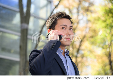 Men calling outdoors 134201013