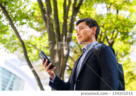 A businessman with a smartphone 134201014