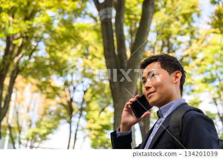 Men calling outdoors 134201039