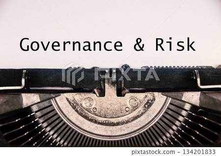 Governance and Risk text on an old typewriter. Policy concept. 134201833